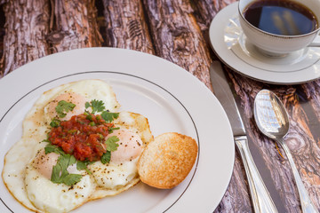 Over-easy eggs with fresh slasa and coffee