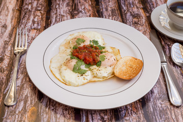 Over-easy eggs with fresh slasa and coffee