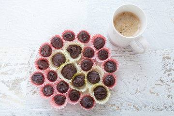Small chocolate desserts and coffee