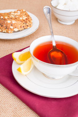 Breakfast with pastries, and hot tea with lemon.