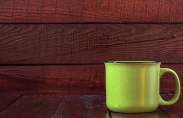 colorful cups on the wooden background