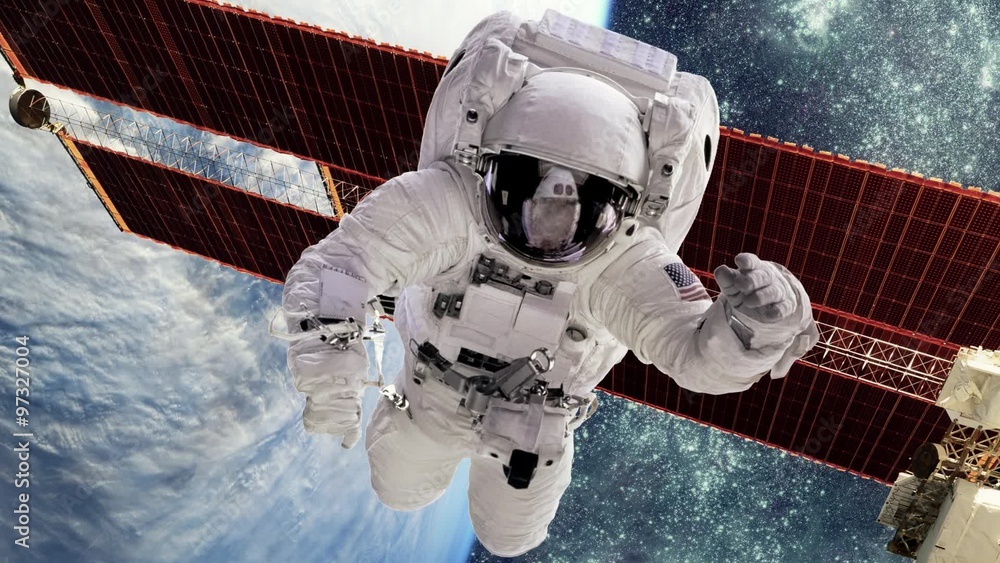 Wall mural astronaut in outer space against the backdrop of the planet earth. elements of this image furnished 