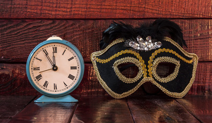 Carnival mask and alarm clock