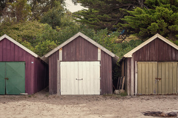 Boat sheds on the beach