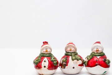 trio of snowmen on a white background 