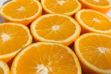 halved oranges , sliced orange fruits closeup