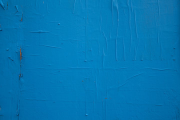 Blue paint and peeling paper