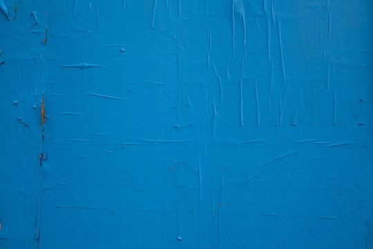 Blue paint and peeling paper