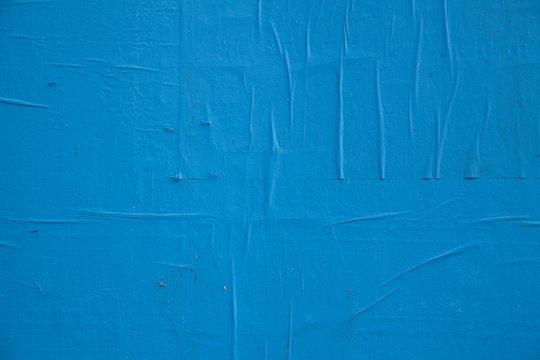 Blue paint and peeling paper
