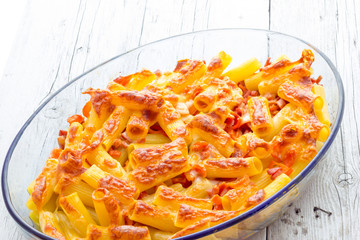 Baked macaroni cheese with tomatoes and sausage