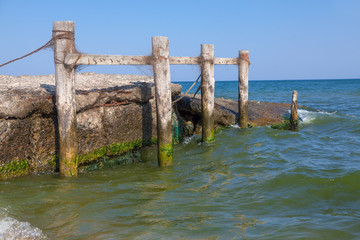 Fototapeta premium wooden poles in sea