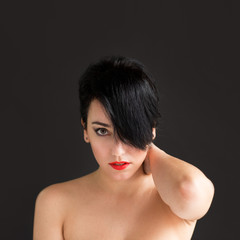 Natural women looking to camera on black background