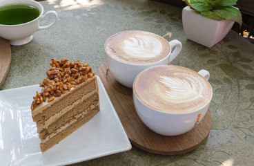 Close up cup of Coffee latte on the wood table