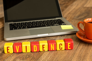 Evidence written on a wooden cube in a office desk