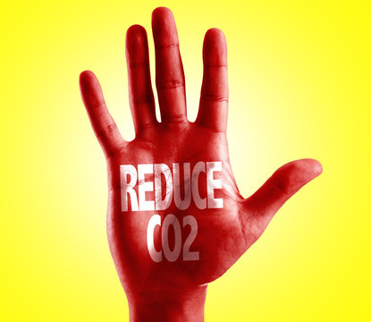 Reduce CO2 written on hand with yellow background