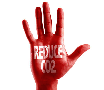 Reduce CO2 written on hand isolated on white background
