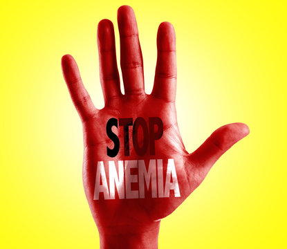 Stop Anemia written on hand with yellow background