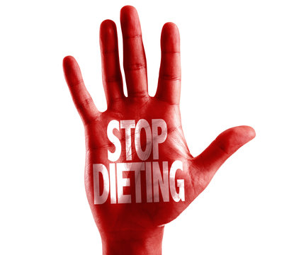 Stop Dieting written on hand isolated on white background