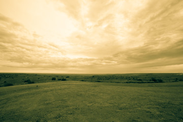 Wide Texas landscape and cloudy sky old-fashioned split toned effect.