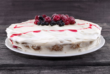 Cake with berries for holiday. Toned image. Selective focus