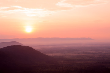 Mountains and fog at sunrise