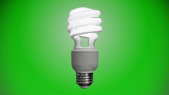 Zoom out of a compact fluorescent bulb flickering until it turns on as the background brightens to a green gradient.