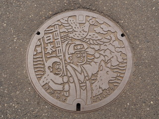 Manhole drain cover on the street at Okayama, Japan. 