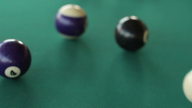 Slow motion HD clip of a billiard ball triangle during the break shot
