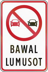 Road sign in the Philippines with Filipino words - Overtaking Prohibited