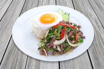 Fried basil leaf with beef and rice..