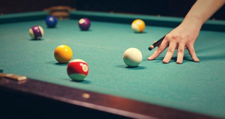 man playing billiard