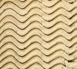 Yellow decorative relief plaster on wall