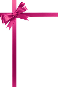 Pink gift ribbon bow vertical upper top corner border frame isolated on white background for christmas or birthday gift decoration photo