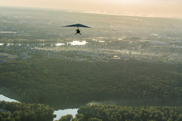 Fototapeta na wymiar hangglider piloting flying extreme sports hobbies aero landscapes