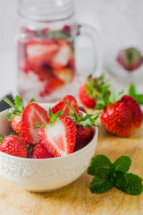 Fresh ripe red strawberries in white bowl
