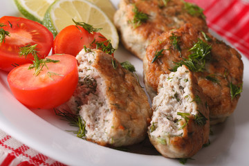 fish cake with herbs macro on a plate. horizontal
