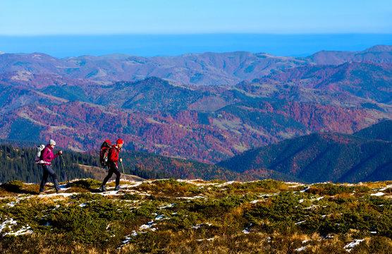 Simple Healthy Lifestyle Concept Image of Two Hikers walking in