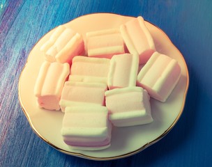 Marshmallows on plate , retro style effect