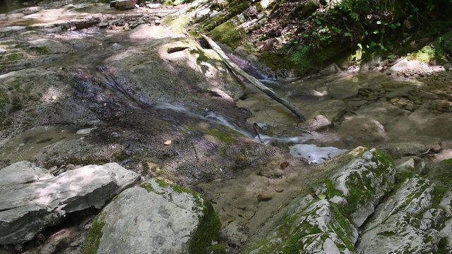 Picturesque clear stream in the mountains near Sochi, Russia