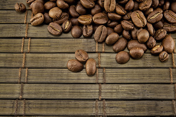 Coffee beans on vintage wooden board