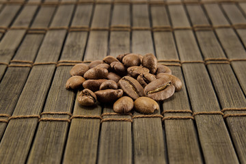 Coffee beans on vintage wooden board