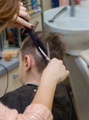 Fototapeta premium boy at barber , haircut