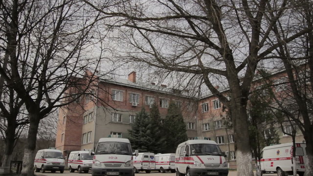 Several Emergency Cars Parked Near Ambulance Station