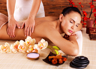 Obraz na płótnie Canvas Masseur doing massage on woman body in spa salon