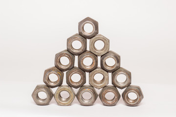 Metal and steel nuts on white background