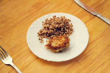 economy food. rissole and buckwheat groats