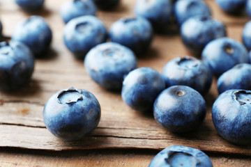 Fresh blueberries on wooden table, closeup