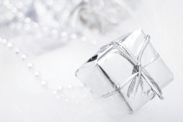 Silver gift box on white blur background