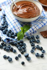 Beautiful composition with chocolate cream and blueberries