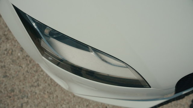 Headlight of the white sports car